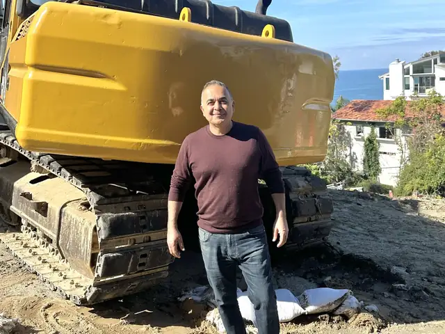 Alex Tabrizi, owner of APlus Interior Design & Remodeling, standing on an Orange County job site